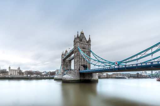 A low angle long exposure shot of the iconic Tower Bridge in London