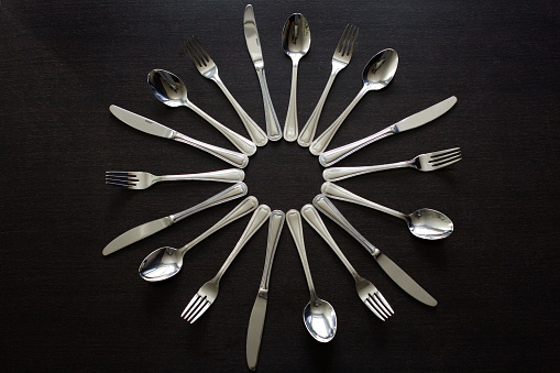 Cutlery on a black background. Fork, spoon, knife.