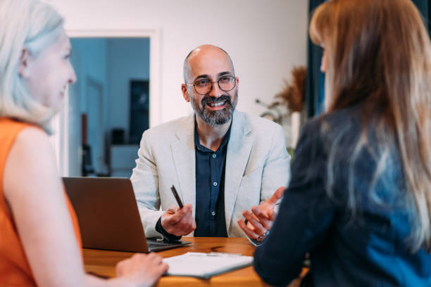istock Group of business persons talking in the office. 2063691289