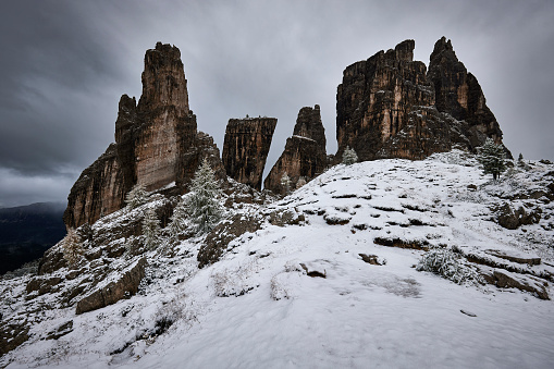 Cinque Torri mountains, autumn in the Dolomites Alps, Trentino Alto Adige, Italy on a grey day with the first snow.