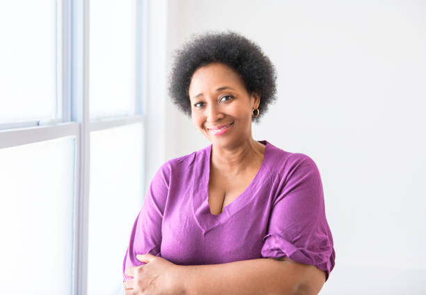 istock senior black American woman on white background studio 2063709706