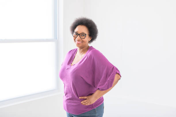 A senior black American woman on white background studio