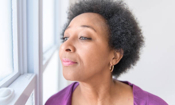 istock senior black American woman on white background studio 2063709801