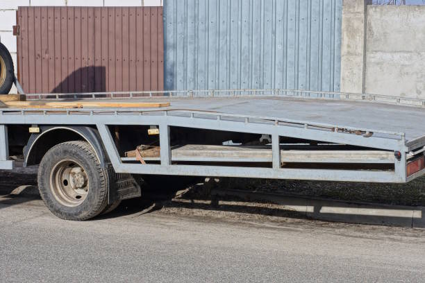 istock part of one tow truck with empty platform trailer 2063716193