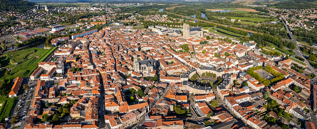 Aerial around the old town of Toul on a sunny day on a late afternoon in early spring.