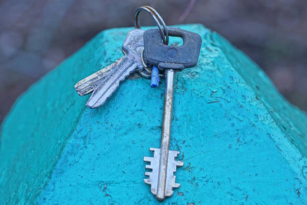 Close up view of keys in a lock of a new home door.