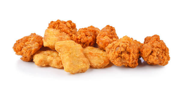 istock Fried spicy chicken wings and nuggets isolated on white 2063740108