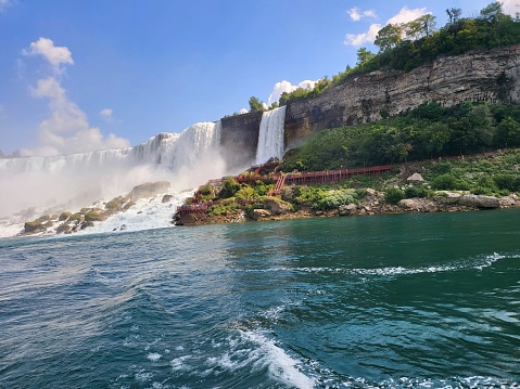 View of US side of Niagara Falls, American Falls and Bridal Veil Falls, seeing from a boat tour.
