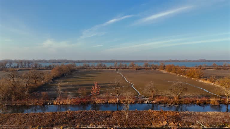 Ismaninger Speichersee Munchen, Bayern, Deutschland. Reservoir and water channels in spring during sunny weather. Water storage system serves as stage in biological treatment of Munich waste water.