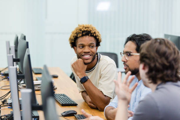 istock Young adult male university students brainstorm on how to complete their project 2063789123