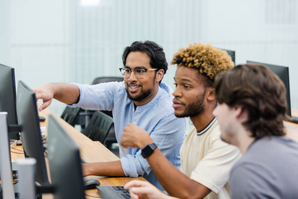 istock Young adult male colleagues work together on a project 2063789126
