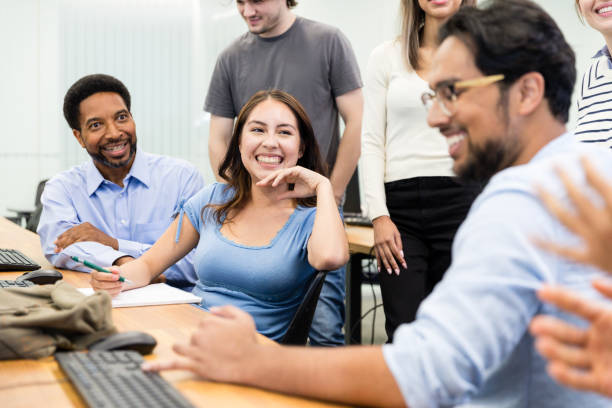 istock Diverse group of students smile and enjoy conversation 2063789666