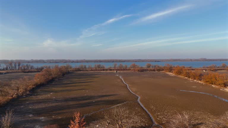 Ismaninger Speichersee Munchen, Bayern, Deutschland. Reservoir and water channels in spring during sunny weather. Water storage system serves as stage in biological treatment of Munich waste water.