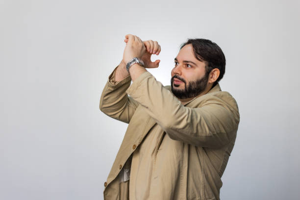 Three quarter length of business man holding telescope in front of eyes