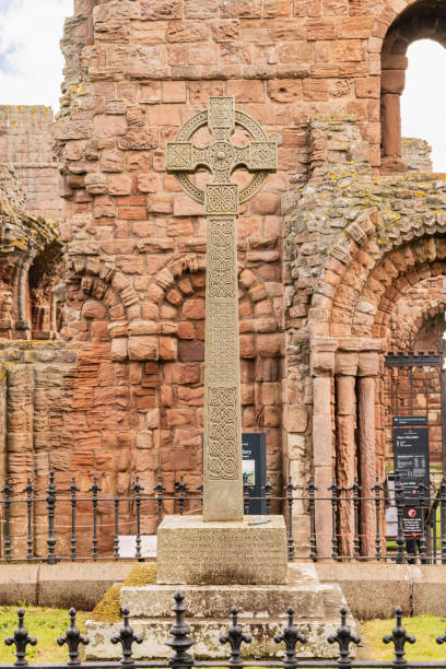 Monument to William Grossman at the ruins of the Lindisfarne Priory. Lindisfarne, Holy Island, Berwick-upon-Tweed, Northumberland, England, Great Briton, United Kingdom. May 1, 2022. Monument to William Grossman at the ruins of the Lindisfarne Priory. lindisfarne monastery stock pictures, royalty-free photos & images