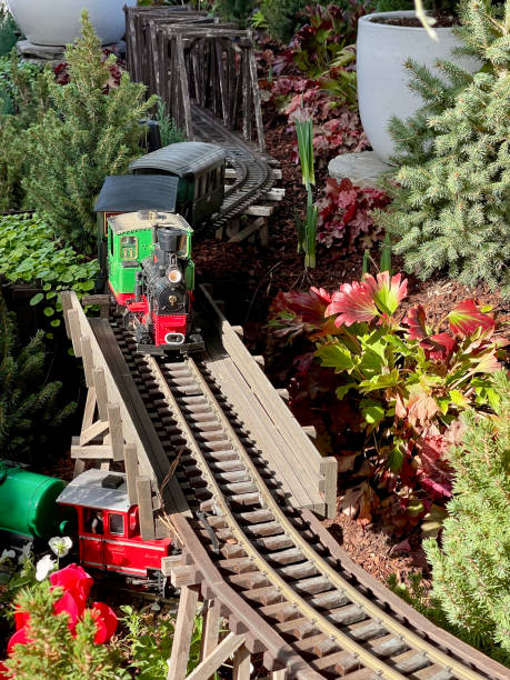 istock Electric toy train railway through the vegetable garden 2063921755