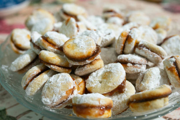 istock Cookies with apricot jam sprinkled with powdered sugar 2063925085
