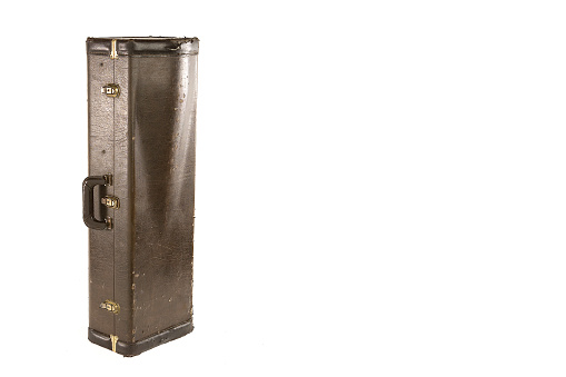 Old brown suitcase for musical instrument, antique case on white background with space for your text or design