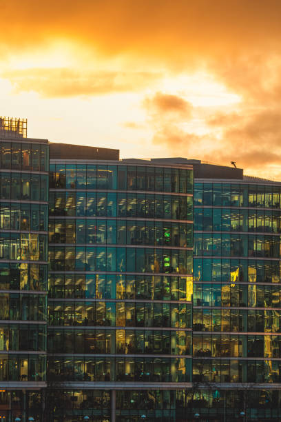 istock Illuminated office buildings in London at Night 2063966893