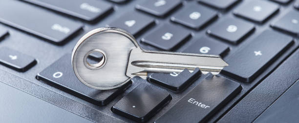 istock phishing, hacking personal data and money , key and hook on computer keyboard. 2063996681