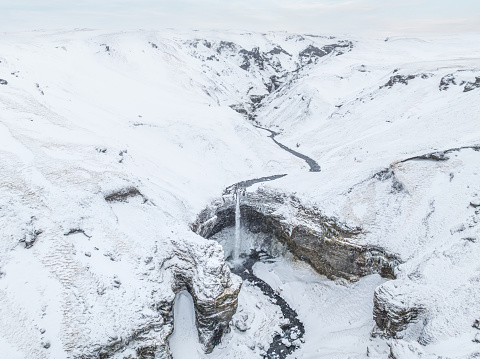 Aerial view of Kvernufoss waterfall in winter, South Iceland