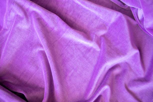 Lilac knitted texture fabric. Purple textile cloth background. Soft material for fashion clothes.