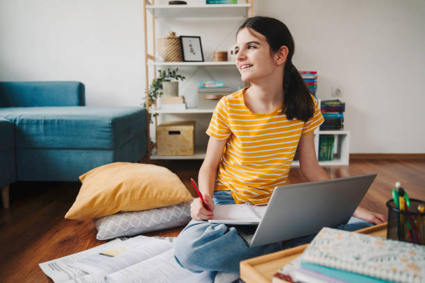 istock Studying from home. Girl is Working on Homework for School. Education Concept 2064041198