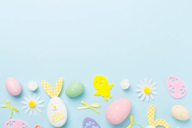 istock Easter eggs and decoration on color background, top view 2064044652