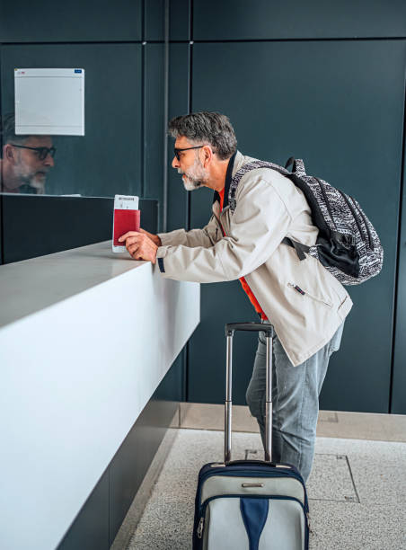 istock Man passenger at the check-in counter 2064044753