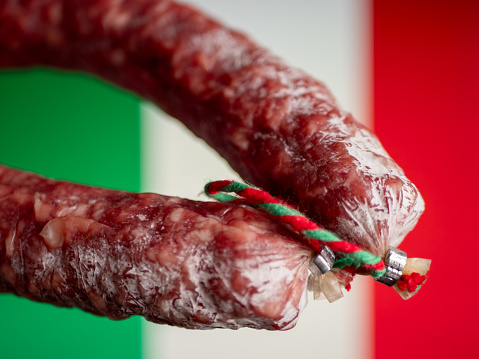 Traditional Italian Salami on Flag Background