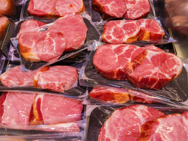 istock Assorted Fresh Raw Meat Cuts on Display at Butcher Shop 2064072394