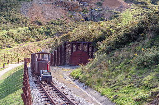 Celis, Spain - May 3, 2014: Mine train that reaches the entrance to the El Soplao Cave, an important tourist attraction in Cantabria, northern Spain