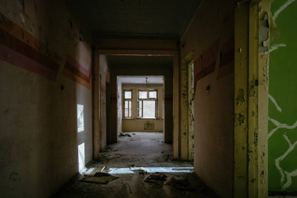 istock Dark creepy corridor of abandoned building 2064083148