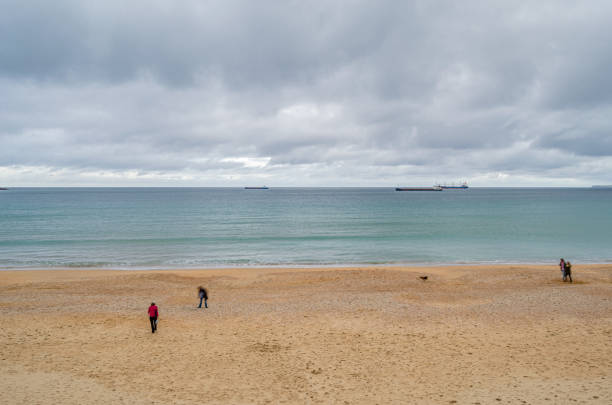 Santander, Spain - May 1, 2014: People walking on Sardinero beach in Santander, Cantabria, northern Spain