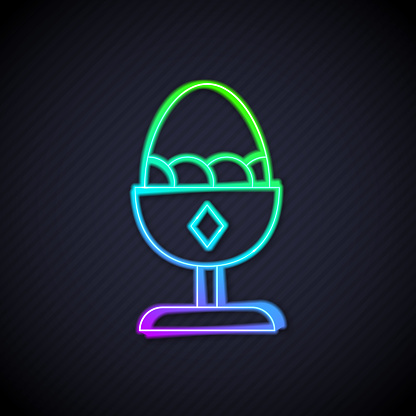 Glowing neon line Chicken egg on a stand icon isolated on black background. Vector.