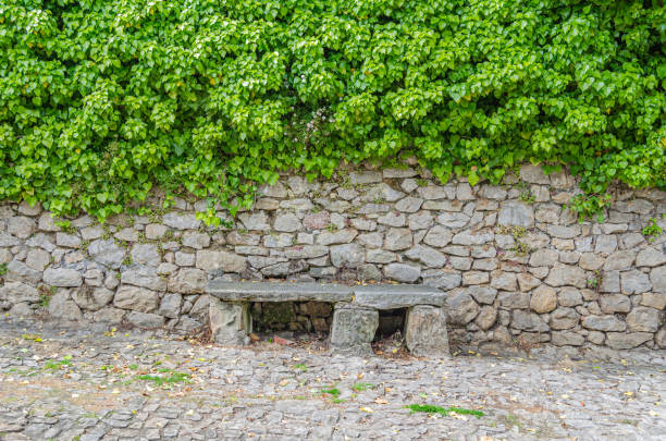 Rustic architectural detail, stone bench in the village of Santillana del Mar, Cantabria, northern Spain