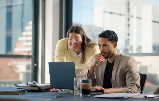 istock Business people, laptop and partner in office, teamwork and collaboration on project. Technology, computer and professional lawyers with happy colleague, employee and good feedback or news online 2064243775