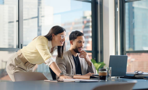 istock Business people, laptop and news in office, teamwork and collaboration on project. Technology, computer and excitement with happy colleague, partner and good feedback from company at lawyer firm 2064243777