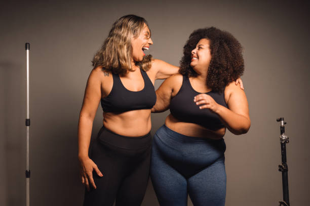 istock Female friends hugging after indoor training 2064243838