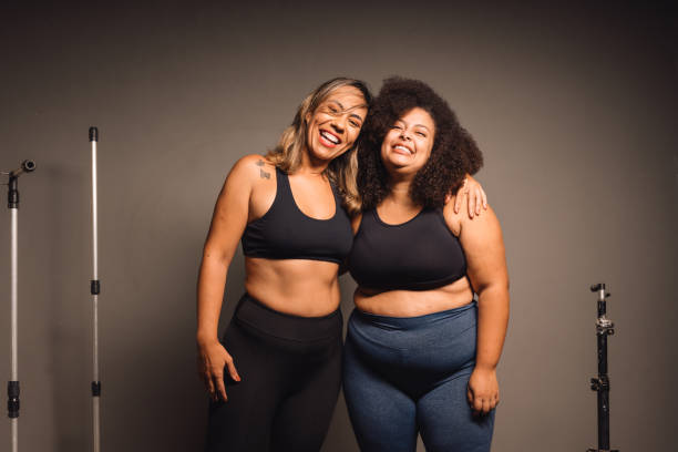 istock Female friends hugging after indoor training 2064243842