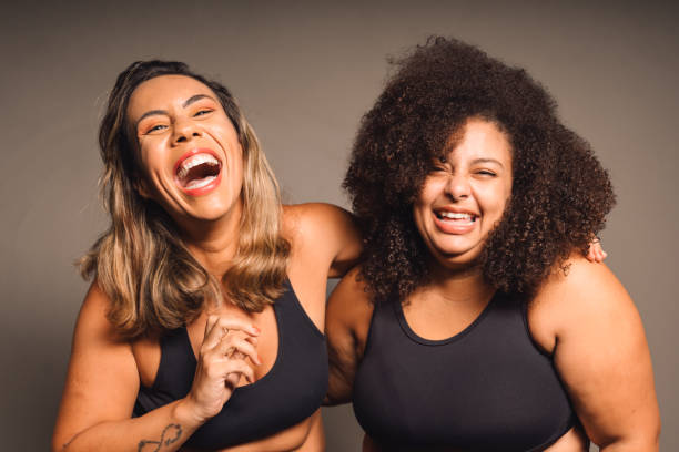 Women with different bodies laughing sharing moments