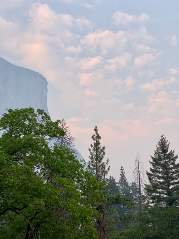 A hazy sunset over El Capitan in Yosemite National Park.