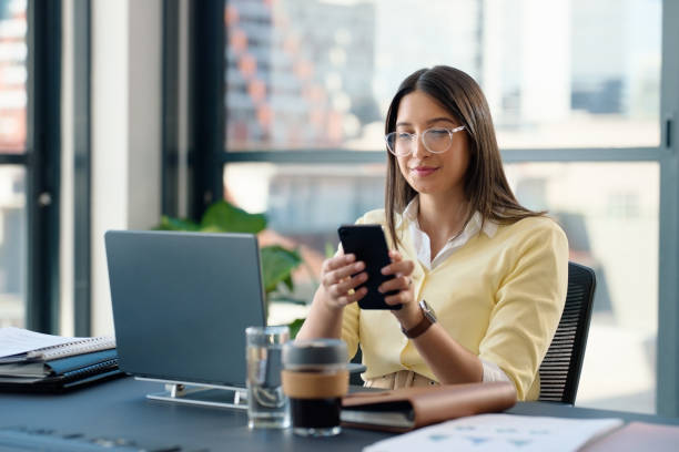 istock Woman, laptop and office with documents, phone or technology for working and planning. Accountant, computer and workspace for business, research or communication for review or feedback with paperwork 2064248142