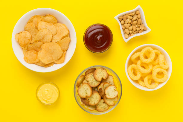istock Various unhealthy snacks on color background, top view 2064271371