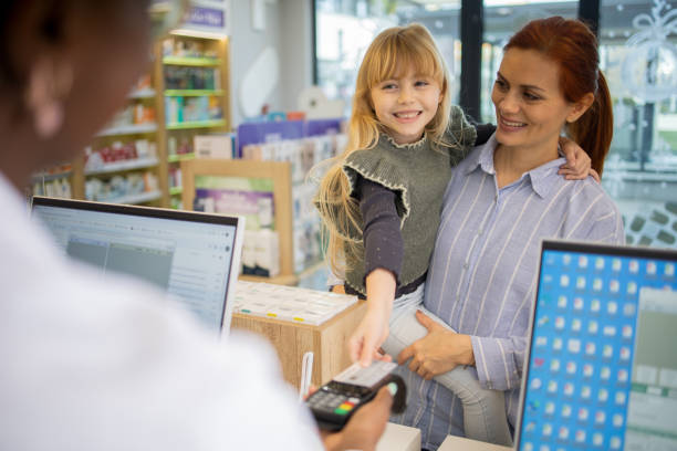 istock Mother and daughter at the pharmacy 2064277722