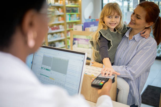 istock Mother and daughter at the pharmacy 2064277726