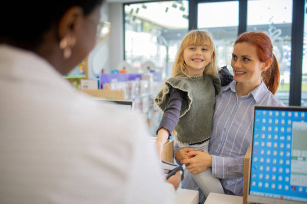 istock Mother and daughter at the pharmacy 2064277744
