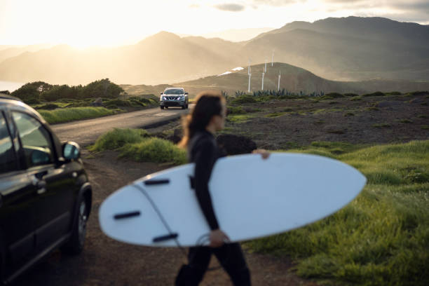 istock Surfing and eco mind. Surfer woman after work. 2064280432