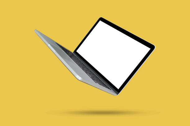 Laptop On Yellow Background. Technology Concept.