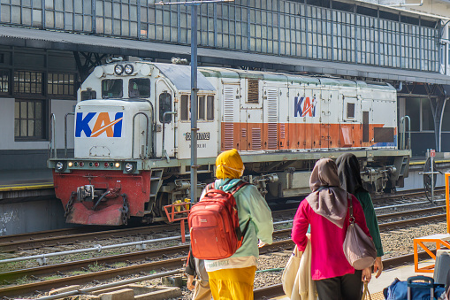 Train arriving at station and one leaving. High angle view.